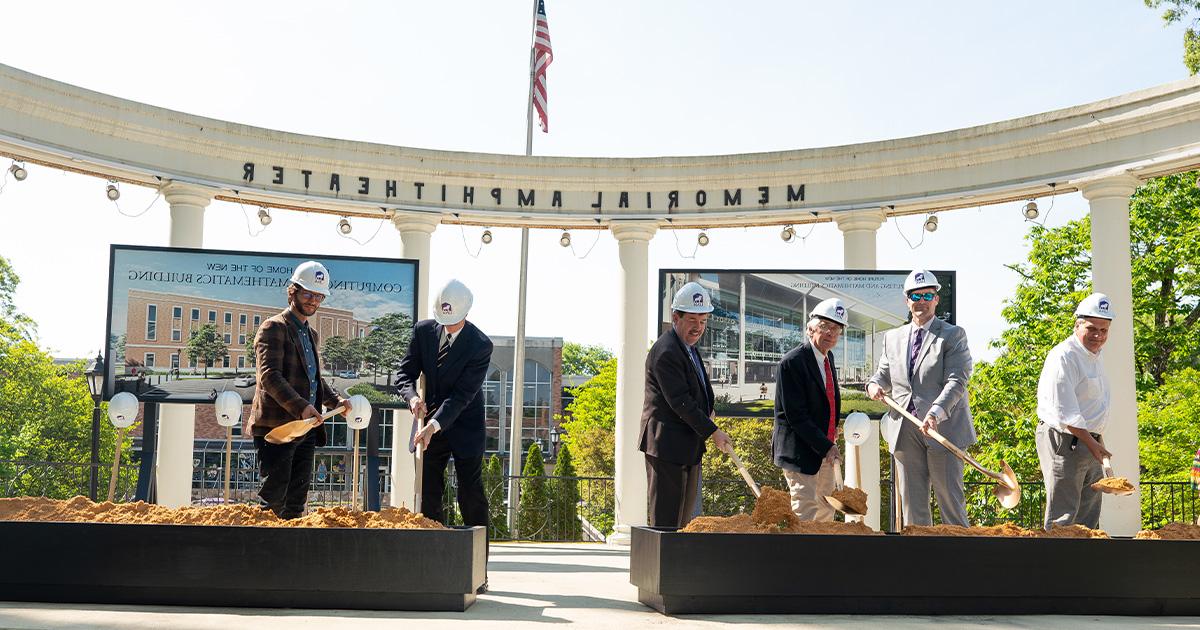 Official from the University of North Alabama, the Shoals Legislative Delegation, and the City of Florence scoop dirt at the Memorial Amphitheater to symbolize breaking ground on the Computing and Mathematics Building.
